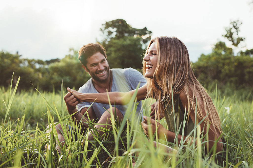 Couple smiling in nature